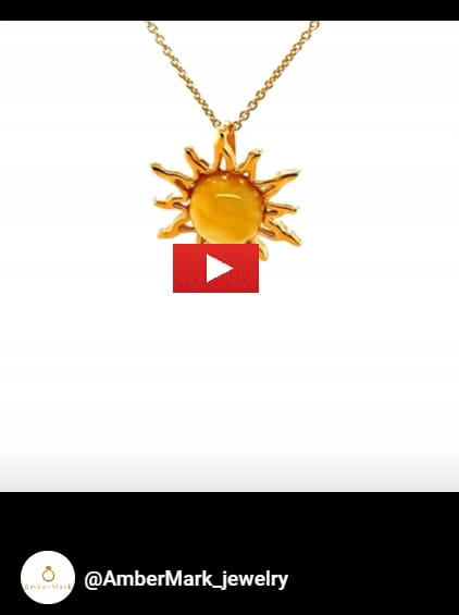 Elegante Halskette mit Sonnenanhänger und Bernstein